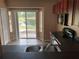 Cozy kitchen with modern appliances and sliding doors offering views of the pond at 15733 Stable Run Dr, Spring Hill, FL 34610