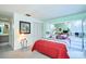 This bedroom features neutral carpeting, a closet with bi-fold doors, and a mirrored dresser with decorative accents at 15917 Dover Cliffe Dr, Lutz, FL 33548