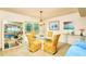 Elegant dining room with glass table, patterned chairs, and natural light at 15917 Dover Cliffe Dr, Lutz, FL 33548