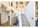 Bright entryway with staircase, tile flooring and modern decor, creates an inviting atmosphere at 15917 Dover Cliffe Dr, Lutz, FL 33548
