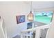 Bright entryway featuring a hanging light fixture, a window, and a staircase at 15917 Dover Cliffe Dr, Lutz, FL 33548