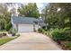 Well-maintained home with a stone accent, lush landscaping, and a spacious driveway, offering great curb appeal at 15917 Dover Cliffe Dr, Lutz, FL 33548
