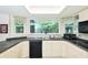 Bright kitchen features white cabinets, large window, and a stainless steel sink at 15917 Dover Cliffe Dr, Lutz, FL 33548