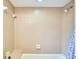 Neutral tiled shower and tub featuring a built-in seat at 15917 Dover Cliffe Dr, Lutz, FL 33548