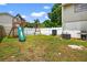 Backyard featuring a playset, providing a fun and engaging space for children to play outdoors at 15925 Marshfield Dr, Tampa, FL 33624