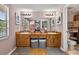 Well lit bathroom with double sink vanity, ample counter space and updated fixtures at 15925 Marshfield Dr, Tampa, FL 33624