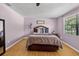 Relaxing bedroom with wood floors and a soft color scheme and decor at 15925 Marshfield Dr, Tampa, FL 33624