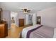 Bright bedroom with wood floors connects to Primary bathroom, hall, and guest bedroom at 15925 Marshfield Dr, Tampa, FL 33624