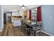Dining area with stylish table, chairs, and access to a well-equipped kitchen at 15925 Marshfield Dr, Tampa, FL 33624