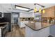 Bright kitchen featuring white cabinets, stainless steel appliances, and stylish countertops at 15925 Marshfield Dr, Tampa, FL 33624