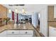 Open kitchen flows into dining/living areas, featuring modern countertops and hardwood floors at 15925 Marshfield Dr, Tampa, FL 33624