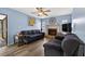 Inviting living room featuring a cozy fireplace, wood-look floors and comfortable seating at 15925 Marshfield Dr, Tampa, FL 33624