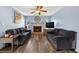 Comfortable living room with fireplace, ceiling fan, and stylish decor with lots of natural light at 15925 Marshfield Dr, Tampa, FL 33624