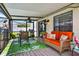 Covered patio offers comfortable seating, a ceiling fan, and outdoor enjoyment at 15925 Marshfield Dr, Tampa, FL 33624