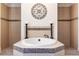 Elegant bathroom featuring a luxurious soaking tub, decorative tile work, and sconce lighting at 165 Mobbly Bay Dr, Oldsmar, FL 34677