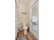 This is a well-kept bathroom with a toilet and access to the lanai and outdoor living space at 165 Mobbly Bay Dr, Oldsmar, FL 34677