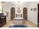 Lavish bathroom offering a central soaking tub, dual walk-in showers, and designer finishes at 165 Mobbly Bay Dr, Oldsmar, FL 34677