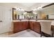 Bright bathroom featuring dual sinks, vanity, large mirrors, and lots of space at 165 Mobbly Bay Dr, Oldsmar, FL 34677