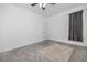 Clean, bright bedroom featuring neutral carpet, a ceiling fan, and great natural light at 165 Mobbly Bay Dr, Oldsmar, FL 34677