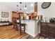 Kitchen with breakfast bar features wood cabinetry, granite countertops, and stainless steel appliances at 165 Mobbly Bay Dr, Oldsmar, FL 34677