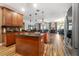 Bright kitchen with granite countertops, stainless appliances, kitchen island, and wood cabinets at 165 Mobbly Bay Dr, Oldsmar, FL 34677