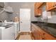Modern laundry room featuring cabinets and washer/dryer at 165 Mobbly Bay Dr, Oldsmar, FL 34677