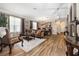 Expansive living room and dining area boasts wood-look tile floors and lots of natural light at 165 Mobbly Bay Dr, Oldsmar, FL 34677