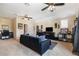 Upstairs living area with carpet, ceiling fans and entertainment center at 165 Mobbly Bay Dr, Oldsmar, FL 34677