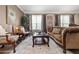Comfortable living room showcases traditional furnishings, an area rug, and lots of natural light at 165 Mobbly Bay Dr, Oldsmar, FL 34677