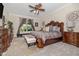 Luxurious main bedroom with carpet, ceiling fan and furnishings at 165 Mobbly Bay Dr, Oldsmar, FL 34677