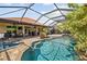 Beautiful swimming pool featuring an attached hot tub, screened lanai and manicured landscaping at 165 Mobbly Bay Dr, Oldsmar, FL 34677