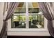 View from the bedroom window showing a covered patio and outdoor pool at 165 Mobbly Bay Dr, Oldsmar, FL 34677
