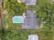Aerial view showcasing the house, the pool, and the spacious backyard at 1711 W Followthru Dr, Tampa, FL 33612