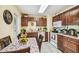 Well-lit kitchen featuring ample cabinet space and a cozy breakfast nook with a garden view at 1711 W Followthru Dr, Tampa, FL 33612