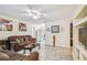 Inviting living room featuring a cozy seating area, tile floors, and easy access to adjacent kitchen at 1711 W Followthru Dr, Tampa, FL 33612