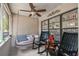 Cozy covered patio with a swing, perfect for relaxing and enjoying the outdoors at 1711 W Followthru Dr, Tampa, FL 33612