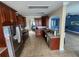 Spacious kitchen features tile floors, stainless steel appliances and wood cabinetry at 1753 Open Field Loop, Brandon, FL 33510