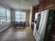 Eat-in kitchen features a stainless steel refrigerator and a large dining area at 1753 Open Field Loop, Brandon, FL 33510