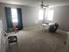 Versatile upstairs loft with carpeting, a ceiling fan, and two windows, perfect for a playroom or home office at 1753 Open Field Loop, Brandon, FL 33510