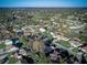 Scenic aerial view of the neighborhood showcases mature trees and well-maintained properties at 2063 De Carlo Ave, Spring Hill, FL 34608
