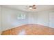 Bright bedroom with wood-look flooring and a ceiling fan at 2063 De Carlo Ave, Spring Hill, FL 34608