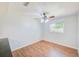 Dining room with wood laminate floors and a modern ceiling fan with lights at 2063 De Carlo Ave, Spring Hill, FL 34608