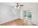Dining area adjacent to sliding glass doors and a view of an exterior jacuzzi at 2063 De Carlo Ave, Spring Hill, FL 34608