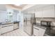 Contemporary kitchen featuring white cabinets and stainless steel appliances at 2063 De Carlo Ave, Spring Hill, FL 34608