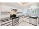 Modern kitchen with stainless steel appliances and sleek countertops at 2063 De Carlo Ave, Spring Hill, FL 34608
