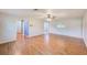 Large living area with pristine walls and beautiful laminate flooring at 2063 De Carlo Ave, Spring Hill, FL 34608