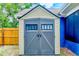 Durable outdoor shed provides extra storage space and features double doors for convenient access at 2063 De Carlo Ave, Spring Hill, FL 34608