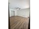 Spacious bedroom featuring wood floors, closet, and a ceiling fan at 2102 Doefield Ct, Valrico, FL 33596