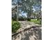 Traditional home boasts a spacious driveway and beautiful, mature trees at 2102 Doefield Ct, Valrico, FL 33596