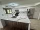 Beautiful kitchen with stainless steel appliances, white cabinets, and island at 2102 Doefield Ct, Valrico, FL 33596